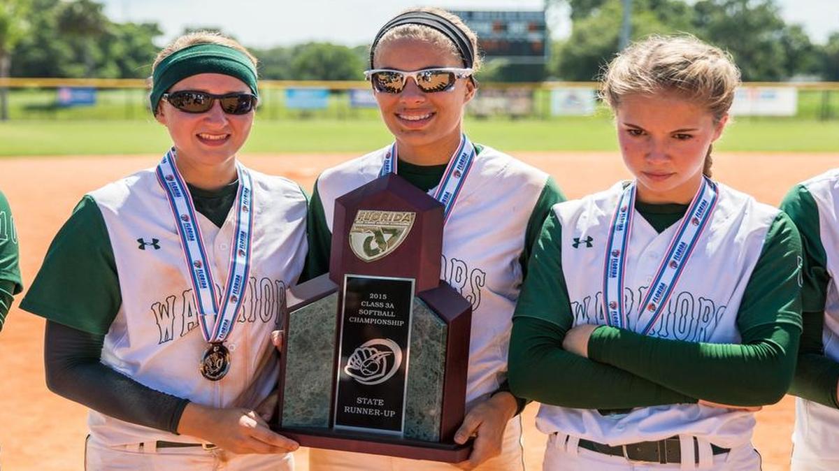 
Westminster Christian's Carlin Labuzan, Ally Mena, Madison Precht and Jackie Feely pose with the state runner-up trophy after losing to Lakeland Christian in the Class 3A state softball final at Historic Dodgertown in Vero Beach, FL, on Thursday, May 7, 2015. 

