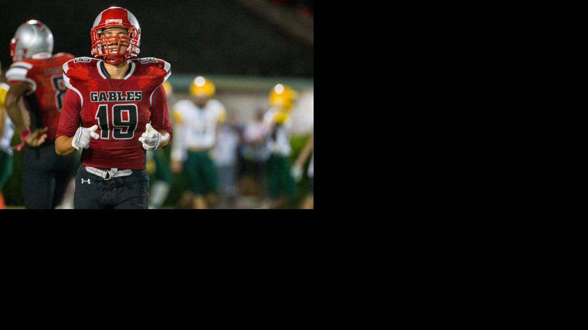 
Coral Gables' Andres Saldivar (#19) reacts after a Miami Killian touchdown during a game at Tropical Park in Miami on Wednesday, October 8, 2014.
