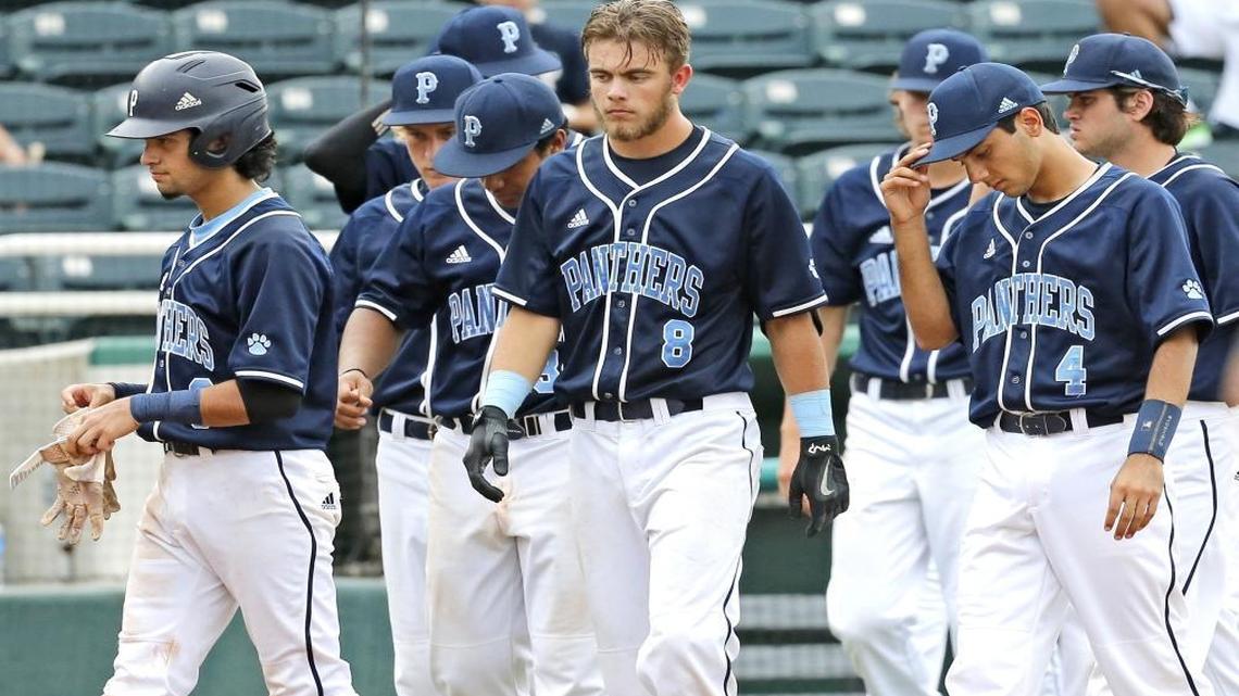 Palmetto's Nick Deegan (8) and fellow teammates walk onto the field after being defeated by the University Titans in Class 9A state semifinalin Class 9A state semifinal at Centurylink Sports Complex - Hammond Stadium in Fort Myers on Fri., June 2, 2017.