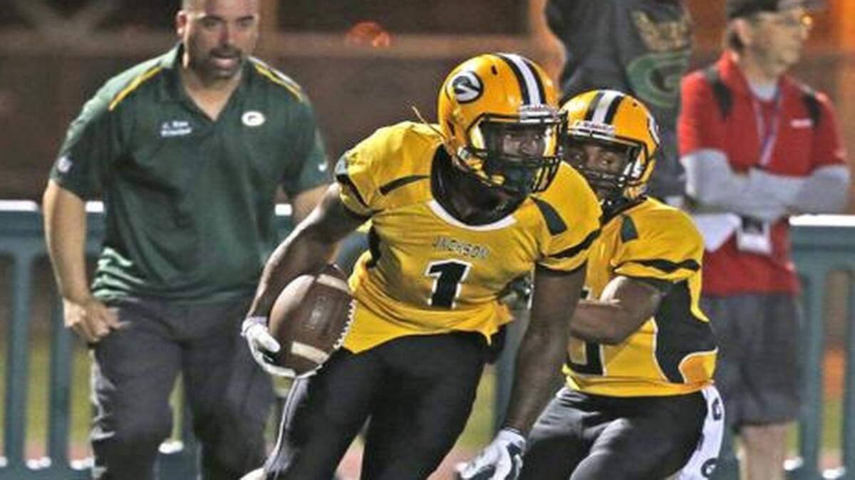 
The Generals' Terrance Rutherford (1) scores in the second quarter as Northwestern High plays Jackson High at Traz Powell Stadium on Friday, Nov. 7, 2014.
