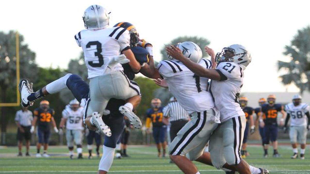 
Belen Jesuit player Frank Battle (1) is unable to catch a pass on the last play of the game against the Ferguson Falcons during the fourth quarter of the high school district football game at the De la Cruz Stadium in Miami on Friday, Oct. 31, 2014. The Falcons won 16-13.
