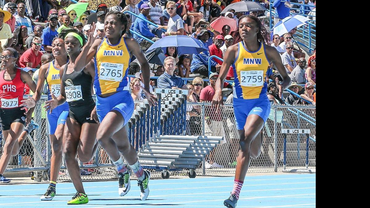 
Miami Northwestern's Lakayla Harris, right, trails her teammate Twanisha Terry in the 100 Meter Dash Final during the Class 3A and 4A FHSAA Track and Field Finals held at University of North Florida in Jacksonville on May 2, 2015.
