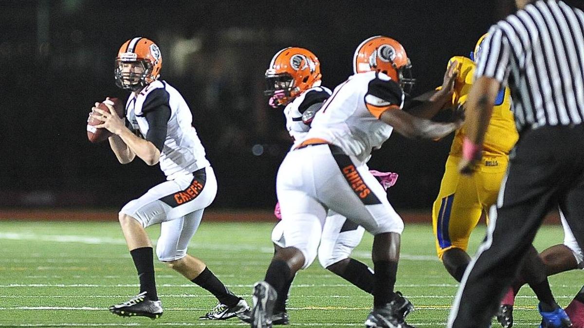 Carol City quarterback Steven Calvert prepares to pass in the first half against Northwestern at Traz Powell Stadium in Miami on Friday, Oct. 30, 2015.