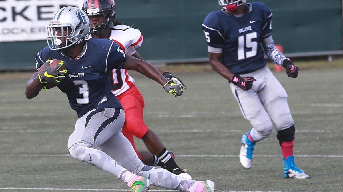 
Gulliver Prep’s Cedrick Wright returns an interception 72 yards for the winning touchdown against Edison on Friday, Oct. 2, 2015 at Sean Taylor Memorial Field. 
