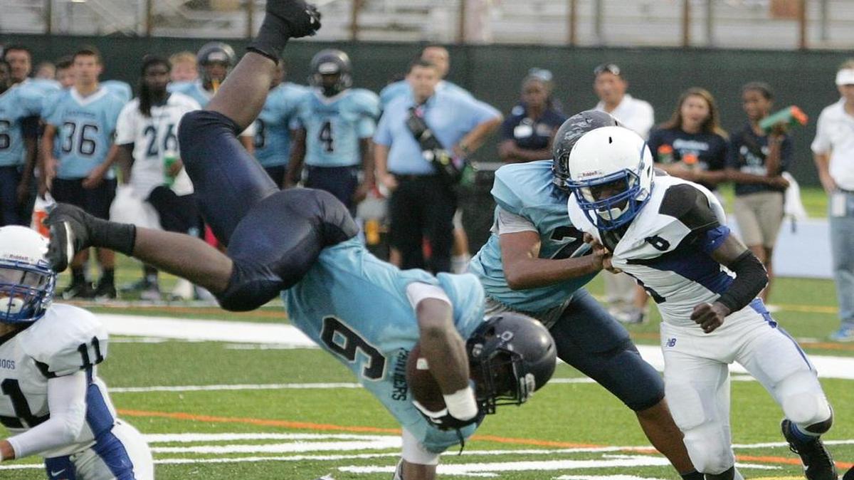 
Palmetto Panthers running back Xzayvious Neal (6) goes airborn during the football game against the Braddock Bulldogs on Thursday, September 10, 2015 at Tropical Park in Miami.
