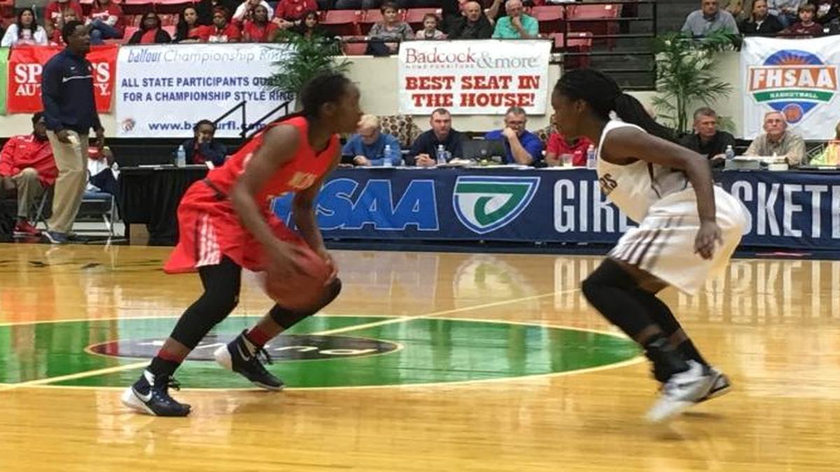 Miami Country Day guard Channise Lewis, left, surveys the court during a Class 3A state semifinal game against Seffner Christian on Tuesday, Feb. 16, 2016 in Lakeland.