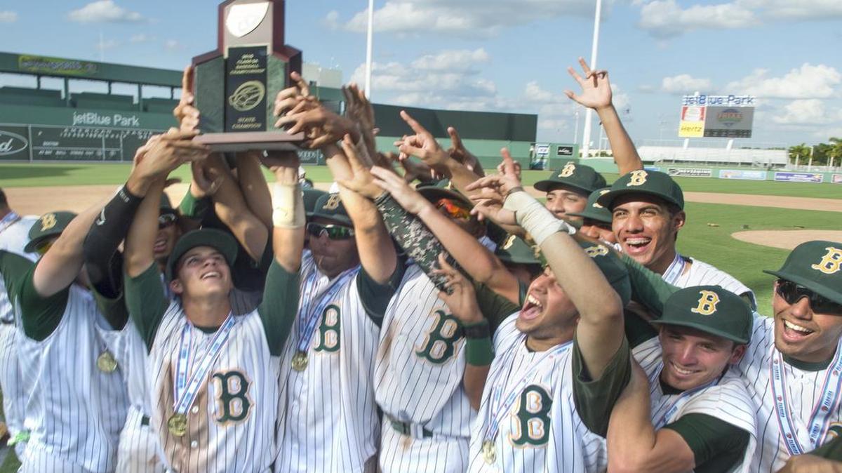 
Brito players hold the trophy aloft after dominating Tampa Bayshore Christian for the school’s seventh baseball championship.
