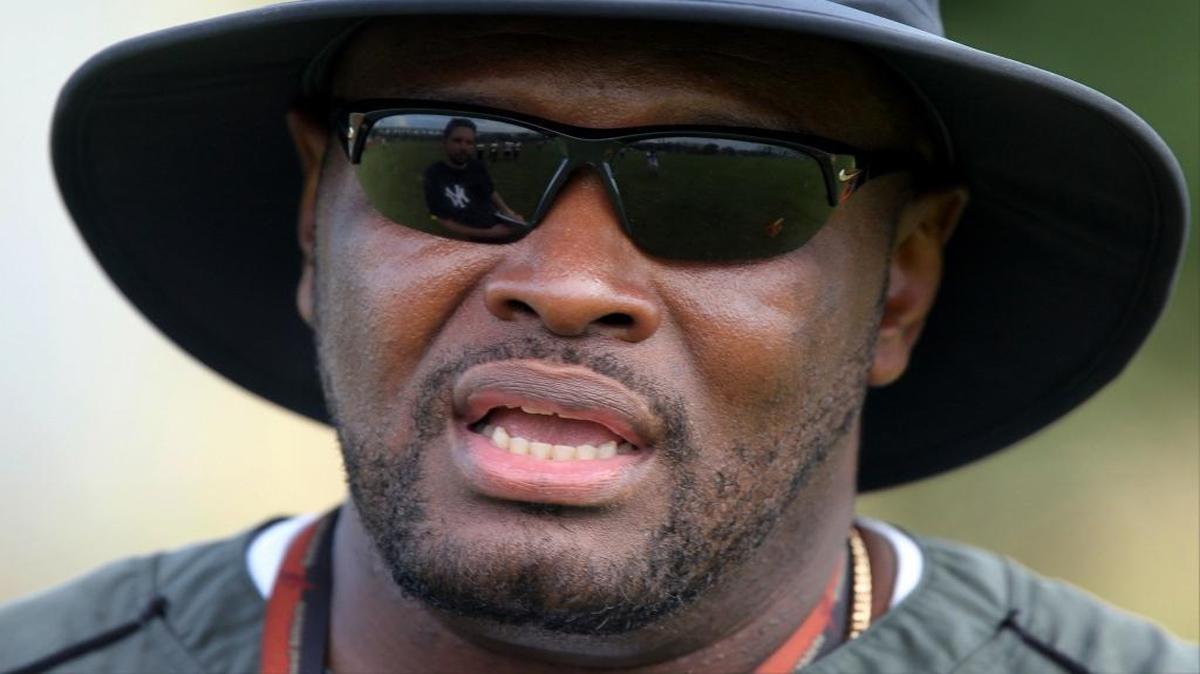 Earl Tillman looks over his team during practice at Booker T. Washington High School on Monday, August 3, 2015.