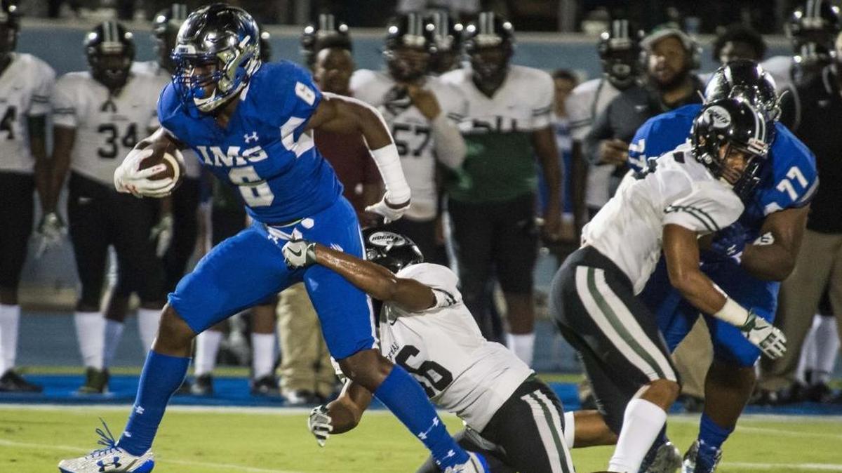 IMG’s Trey Sanders powers through Miami Central’s defense. Sanders got his first start as a sophomore in 2016. Facing national power Long Beach Poly (California), Sanders rushed for over 200 yards, immediately stamping himself as a player to watch.