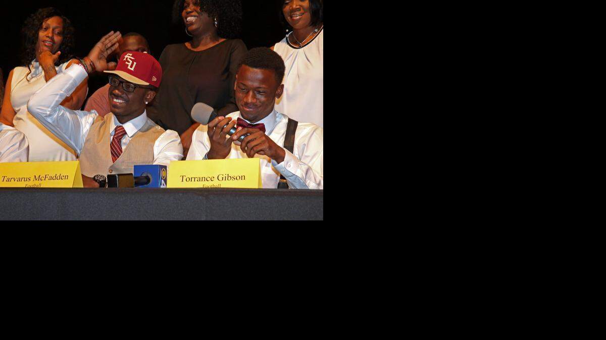 
American Heritage defensive back Tarvarus McFadden goes to FSU, and Torrance Gibson goes to Ohio State during National Signing Day Wednesday Feb. 4, 2015.
