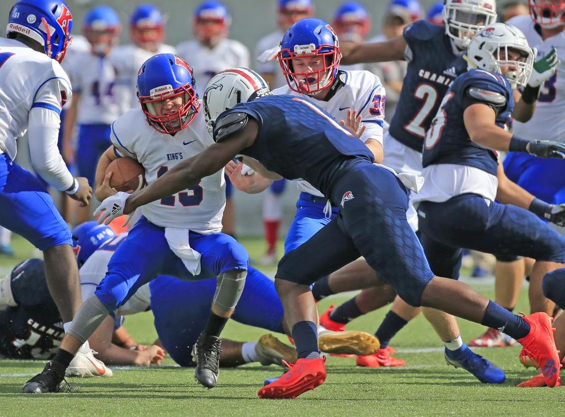 Chaminades Keontra Smith (1) sacks King’s quarterback Justin Wake (13) in the first quarter as Chaminade-Madonna Lions plays King’s Academy during the Florida High School Athletic Association Class 3A State Championship at Camping World Stadium in Orlando on Friday, December 7, 2018.