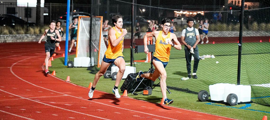 Armando Cruz (glasses) and Jack Michalak of the Belen Jesuit track & field team.