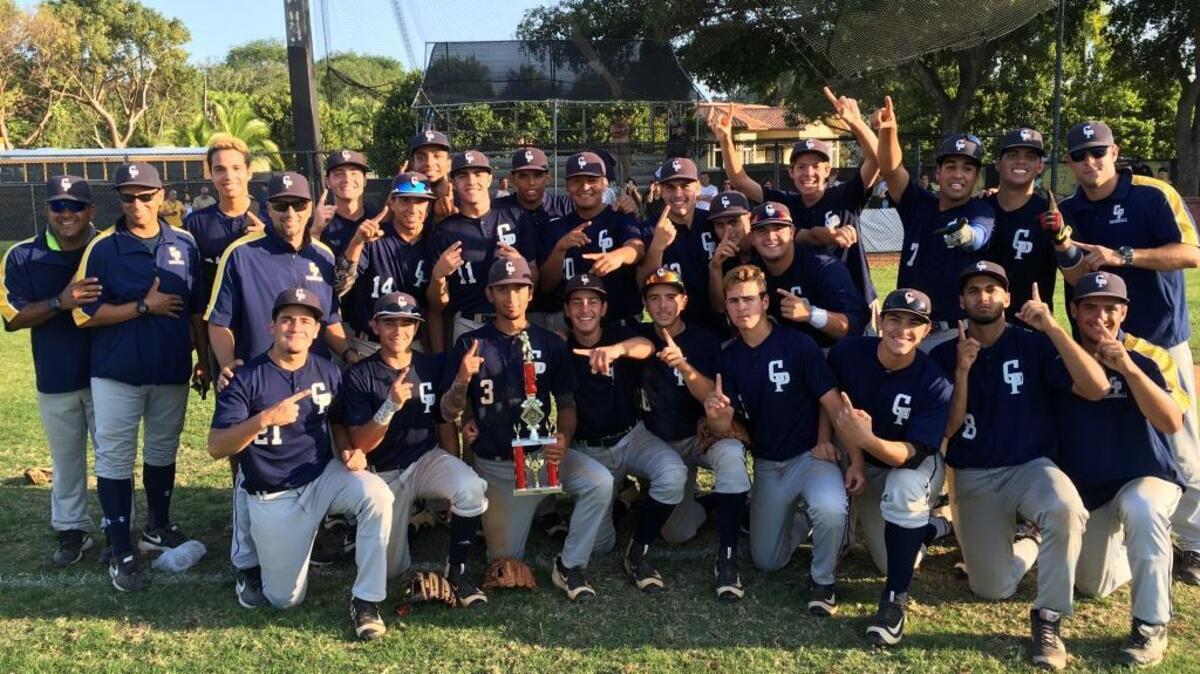 The Miami Coral Park High baseball team celebrates its first GMAC championship since 1977 shortly after beating Columbus 8-6 on Thurs., April 27, 2017 at Miami Killian High.
