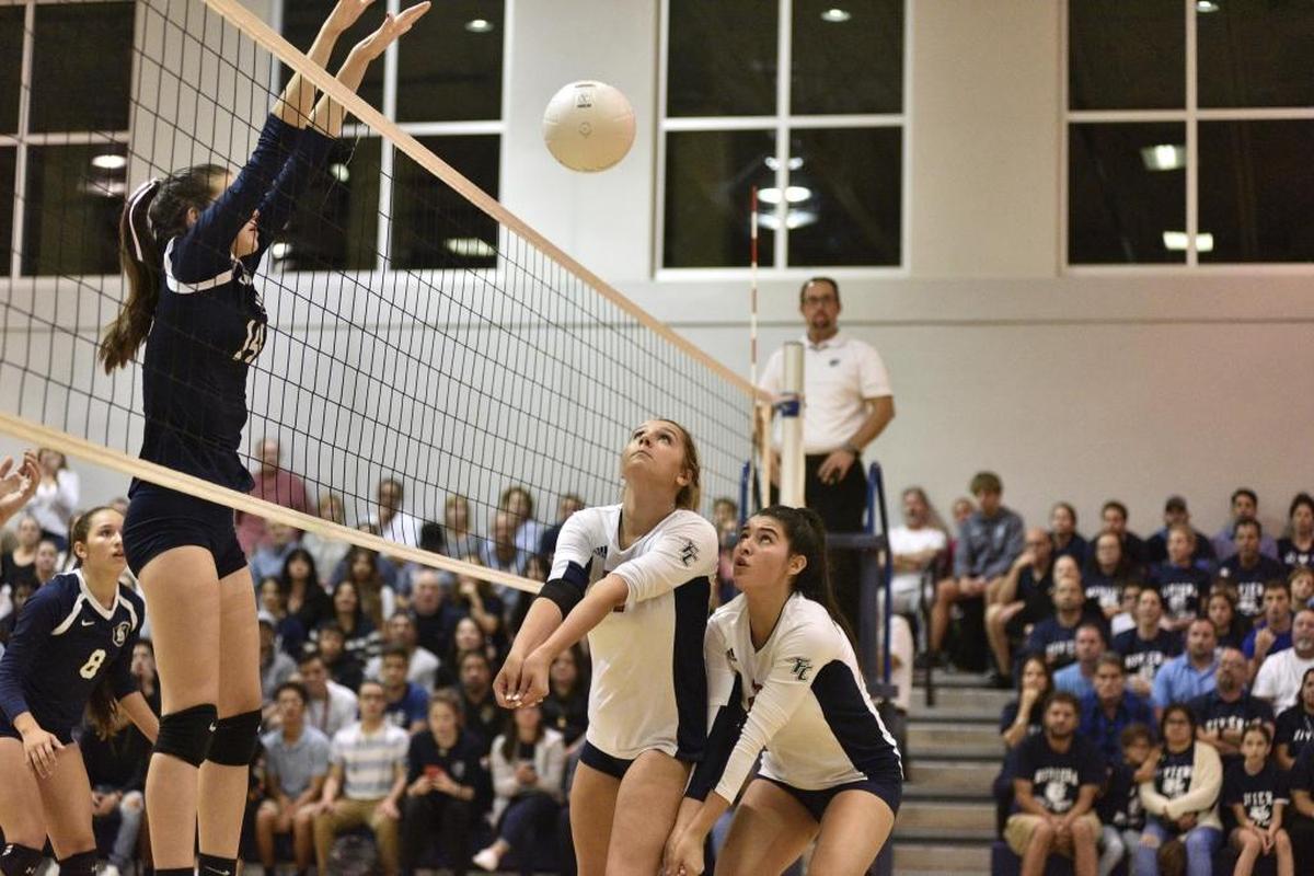 Kaitlyn Nunez (14) and Gianna Ortiz (2) from Florida Christian School in action against Rivera Prep in high school volleyball, Thurs., Nov. 2, 2017