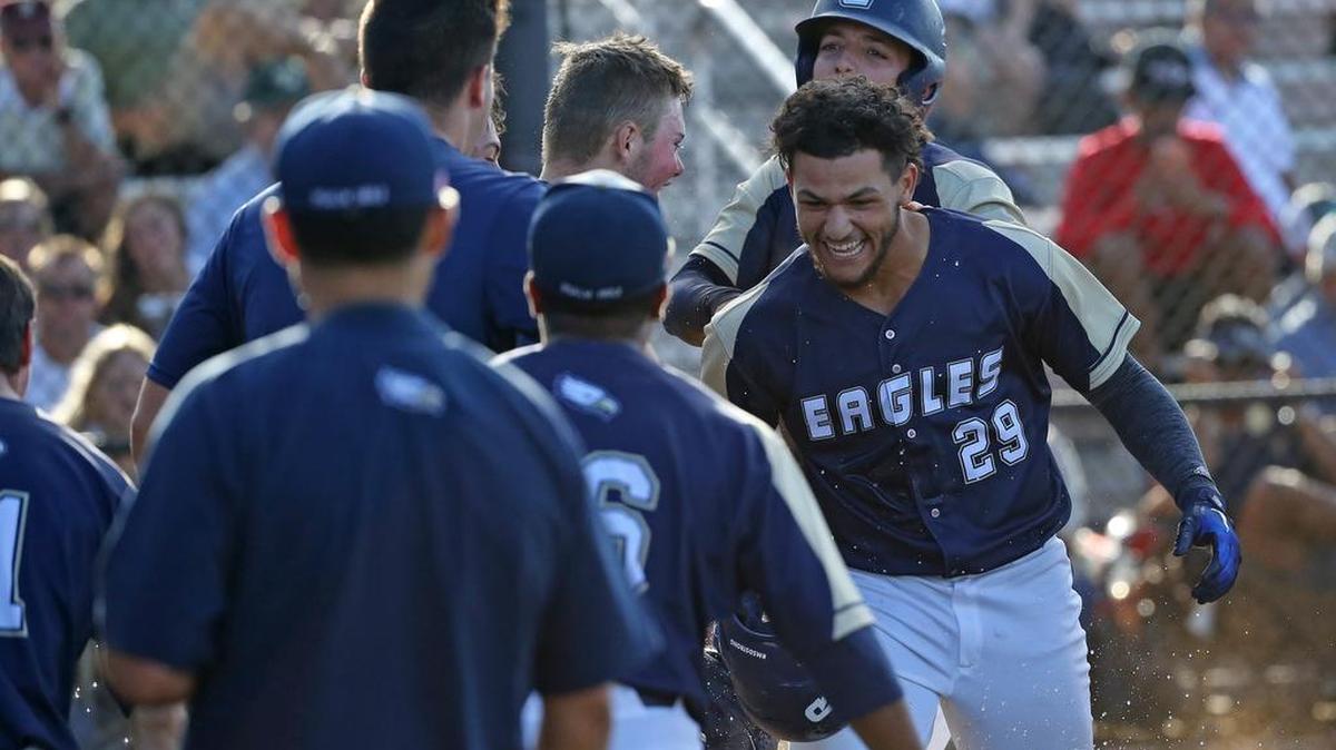 Teammates congratulate Calvary Christian infielder Mykanthony Valdez after he hit a solo homer against Westminster Christian during the sixth inning Wednesday’s