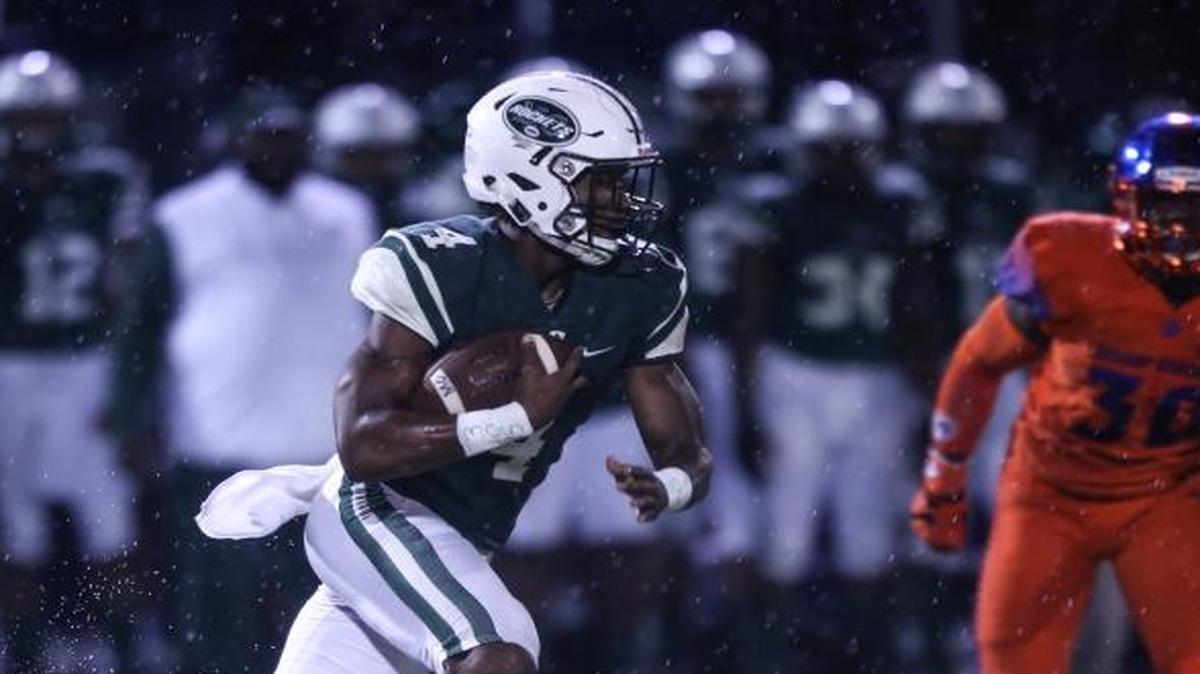 Miami Central running back James Cook runs past Bishop Gorman defenders during the first quarter of the Rockets’ 24-20 victory against the three-time defending national champion on Friday night. Central is still in Las Vegas and practicing in a hotel parking lot.