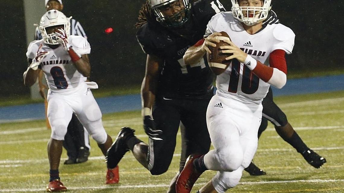 Central Dwayne Boyles, defensive end, center, run down Chaminade quarterback Daelen Menard for the sack during first half action of the Central vs Chaminade opener at Traz Powell Stadium.