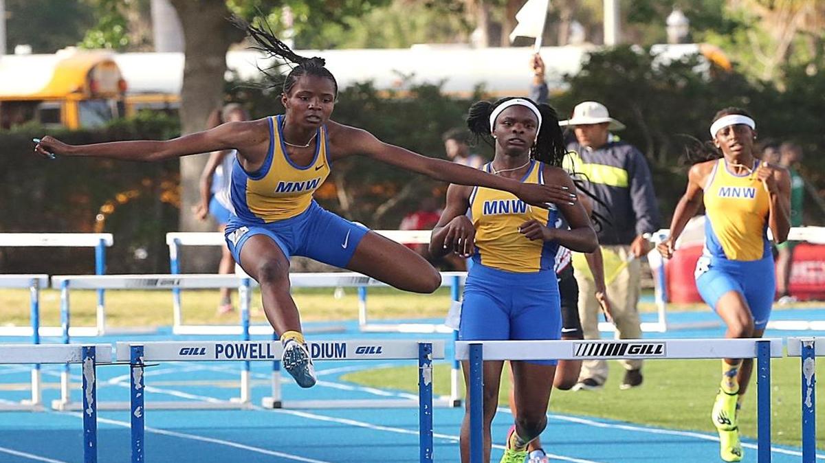 Northwestern High School’s De'Andreah Young wins in the girls 300-meter hurdles during the GMAC Track and Field Championship at Traz Powell Stadium in North Miami on Saturday, March 25, 2017.