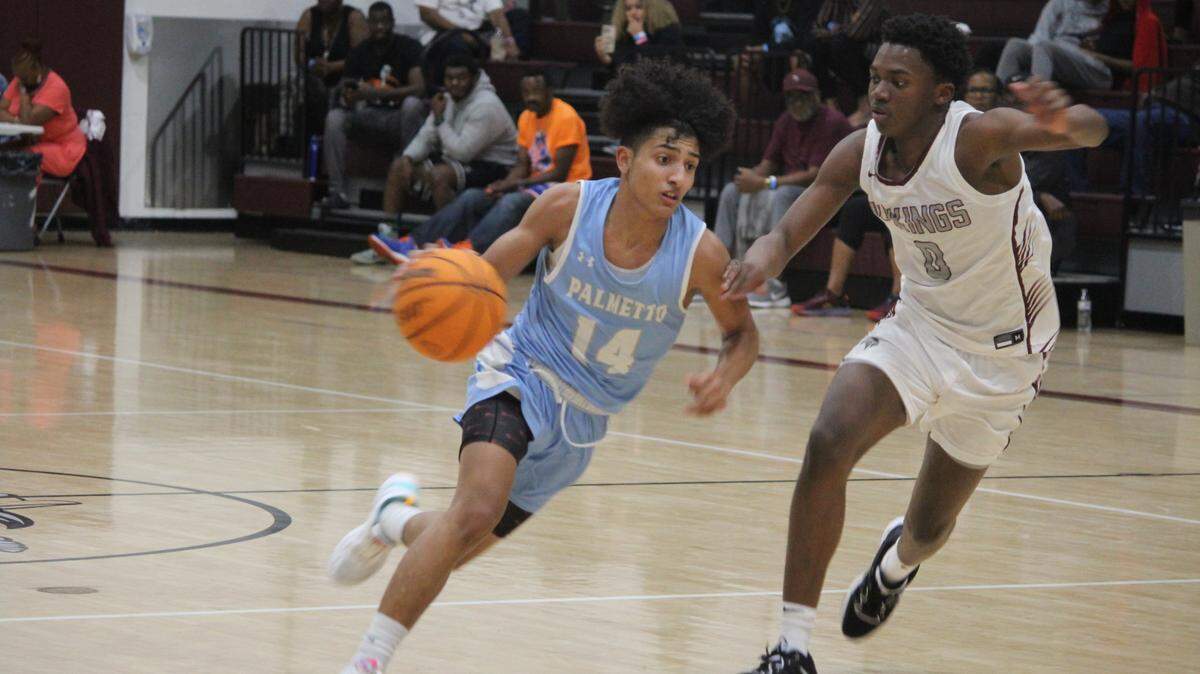 Palmetto’s Santiago Henriquez tries to drive past Norland’s Caleb Clarke during Wednesday’s GMAC semifinal game at Miami Norland High.
