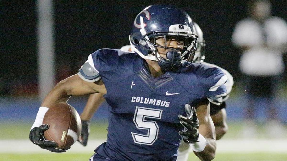 Columbus’ CJ Henderson runs against Booker T. Washington during their football game on Friday, October 23, 2015 at Tropical Park in Miami.