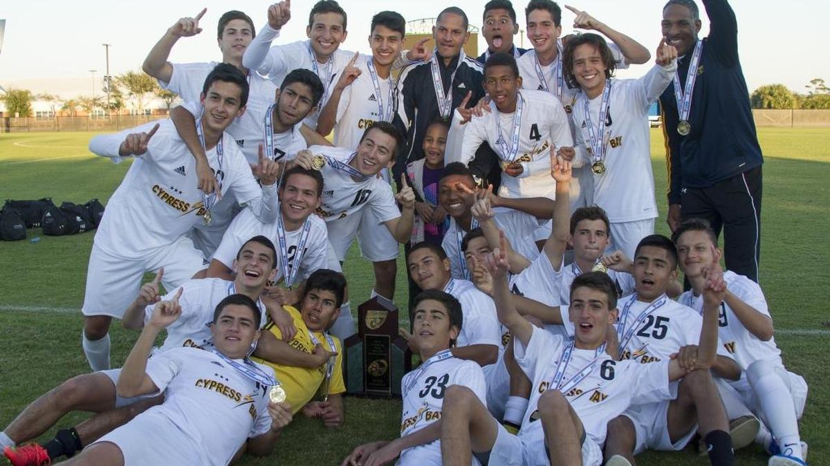 Cypress Bay players celebrate their Class 5A state soccer championship Feb. 14, 2015 in Melbourne, Fla.
