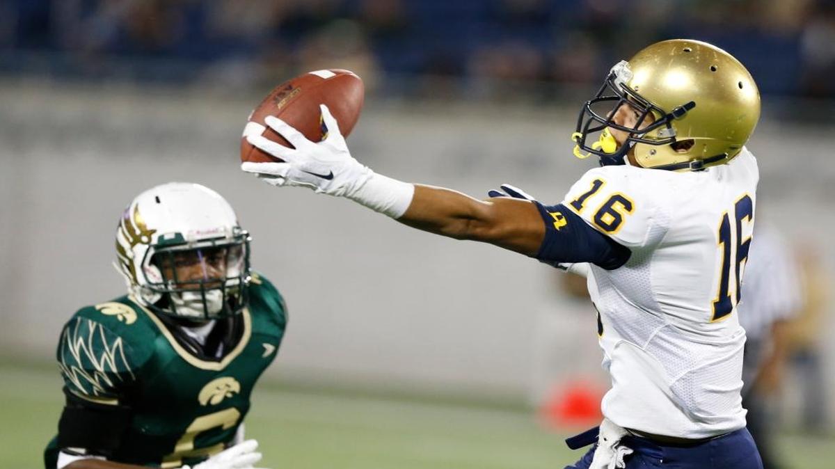 On a trick play, St. Thomas Aquinas WR Michael Harley (3), catches a pass then throws to wide receiver Trevon Grimes (16) for a long pass and a first down in the second quarter. St. Thomas Aquinas vs Viera Hawks at the 2015 FHSAA Football Class 7A Championship at the Citrus Bowl in Orlando on Friday, December 11, 2015.