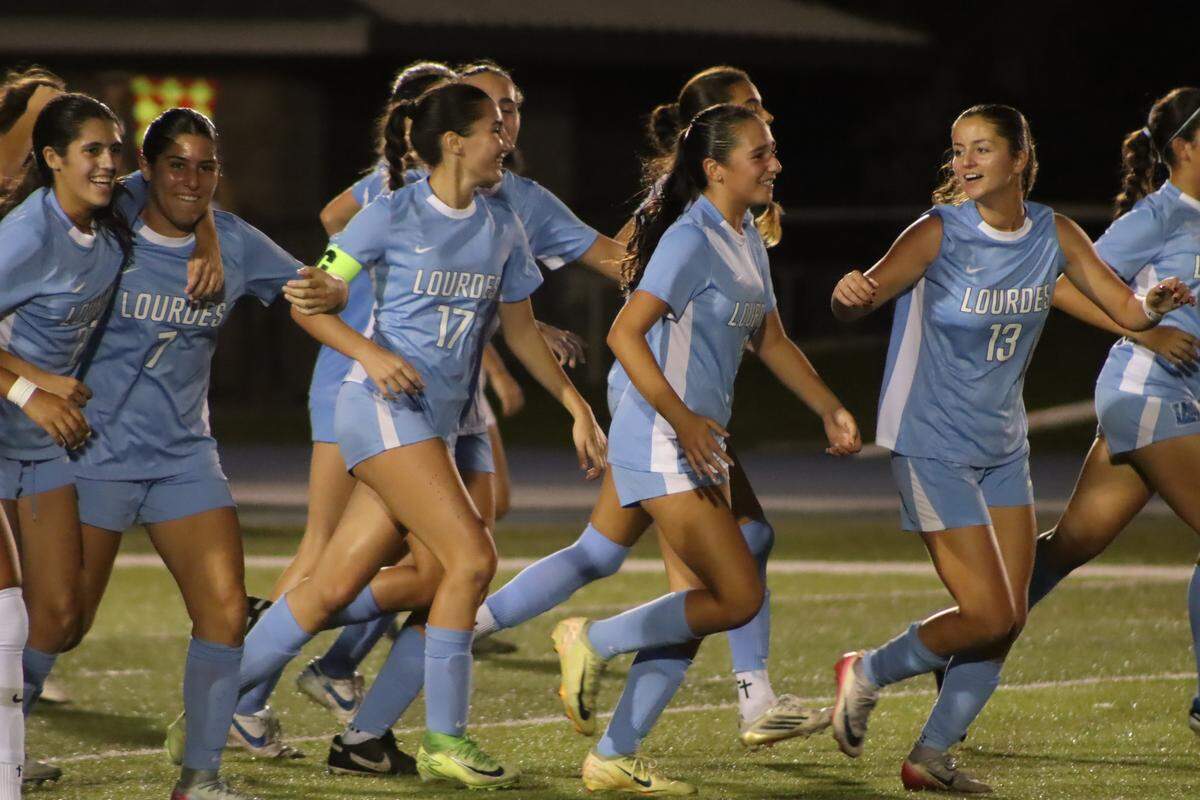 The Lourdes girls’ soccer team celebrates a goal en route to beating 3A state champ Boynton Beach Somerset Academy.
