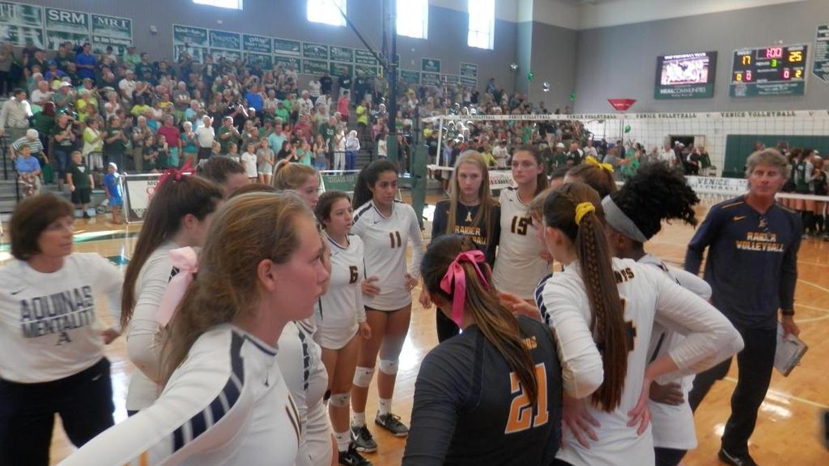 St. Thomas players console each other after losing to Venice 25-21, 25-22, 25-17 in a Class 8A state semifinal.