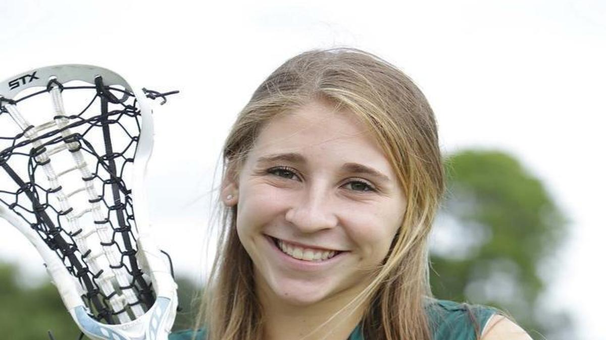 Pine Crest lacrosse player Tara Shecter poses along with other Broward all-county lacrosse athletes at Piccolo Park in Hollywood on May 16, 2016.