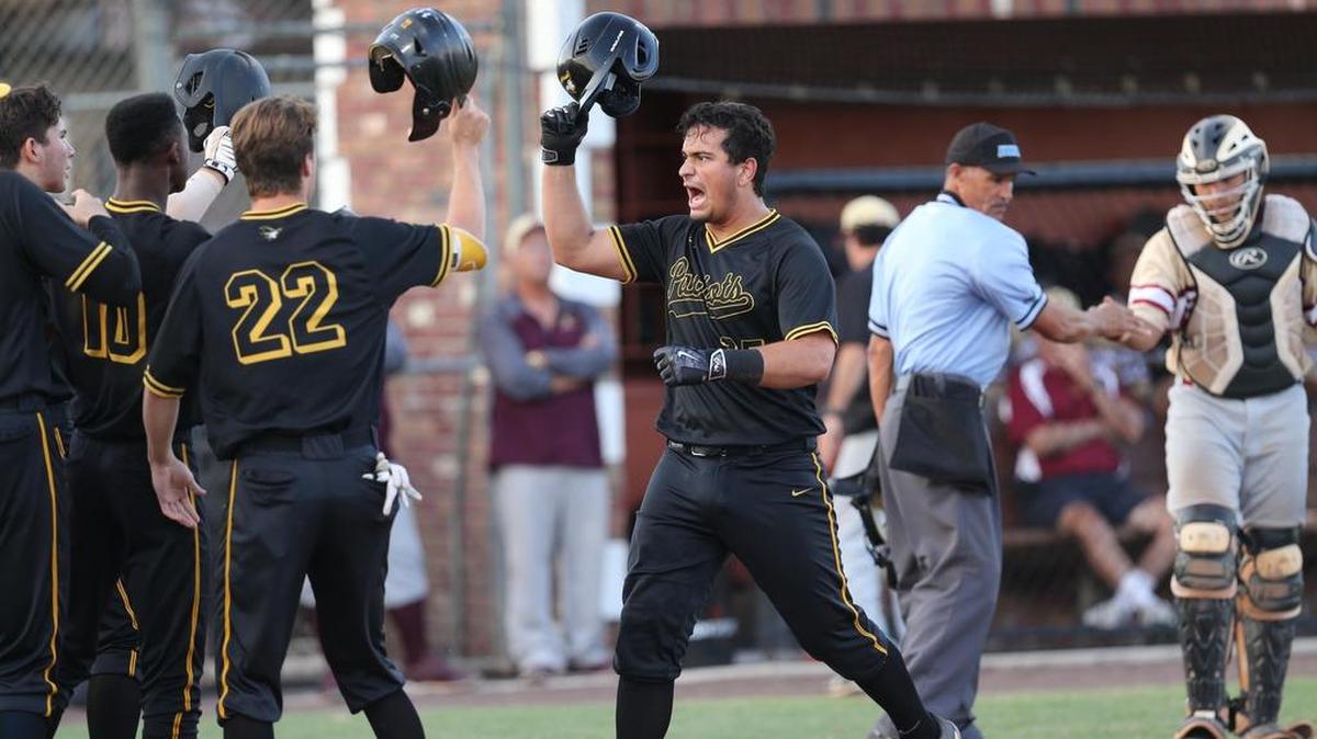 American Heritage’s Julio Cortez, right, is congratulated by teammates, including Corey Acton (22), after Cortez hit a home run in the first inning against Coleman Carroll High School at American Heritage on Tuesday.