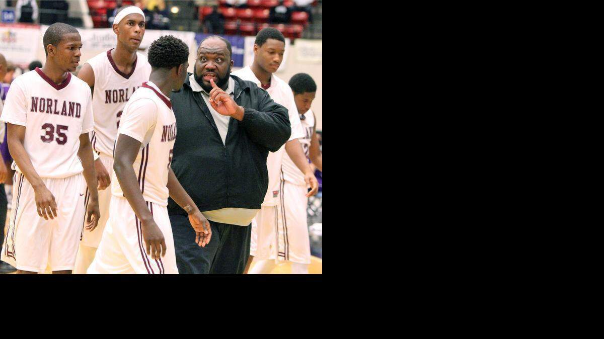 
Norland's Lawton Williams head coach offers advice during a time out against Gainesville during the FHSAA Boys 6A Basketball championship Saturday February 28, 2015 in Lakeland, FL. 
