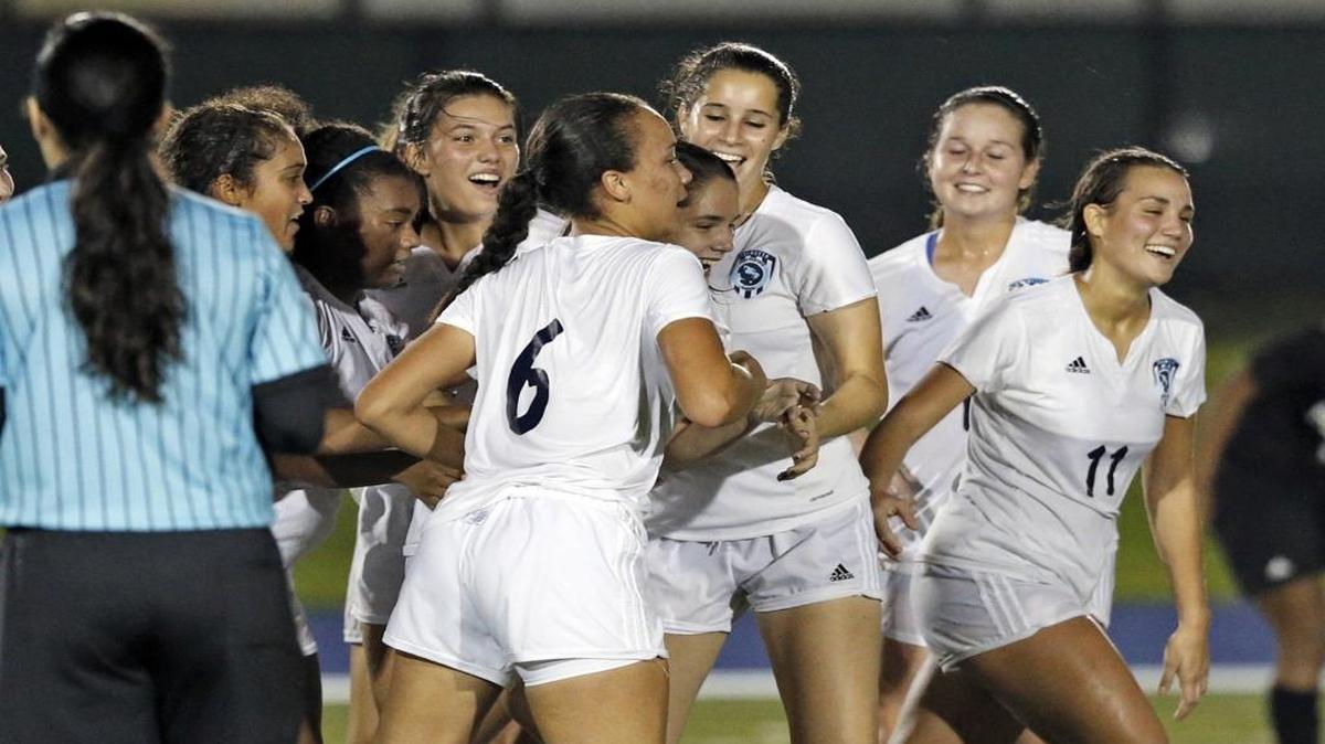 Palmetto celebrates its first goal by Emily Lamas (10) during the GMAC girls’ soccer championship match against Ferguson at Tropical Park on Friday, January 8, 2016.