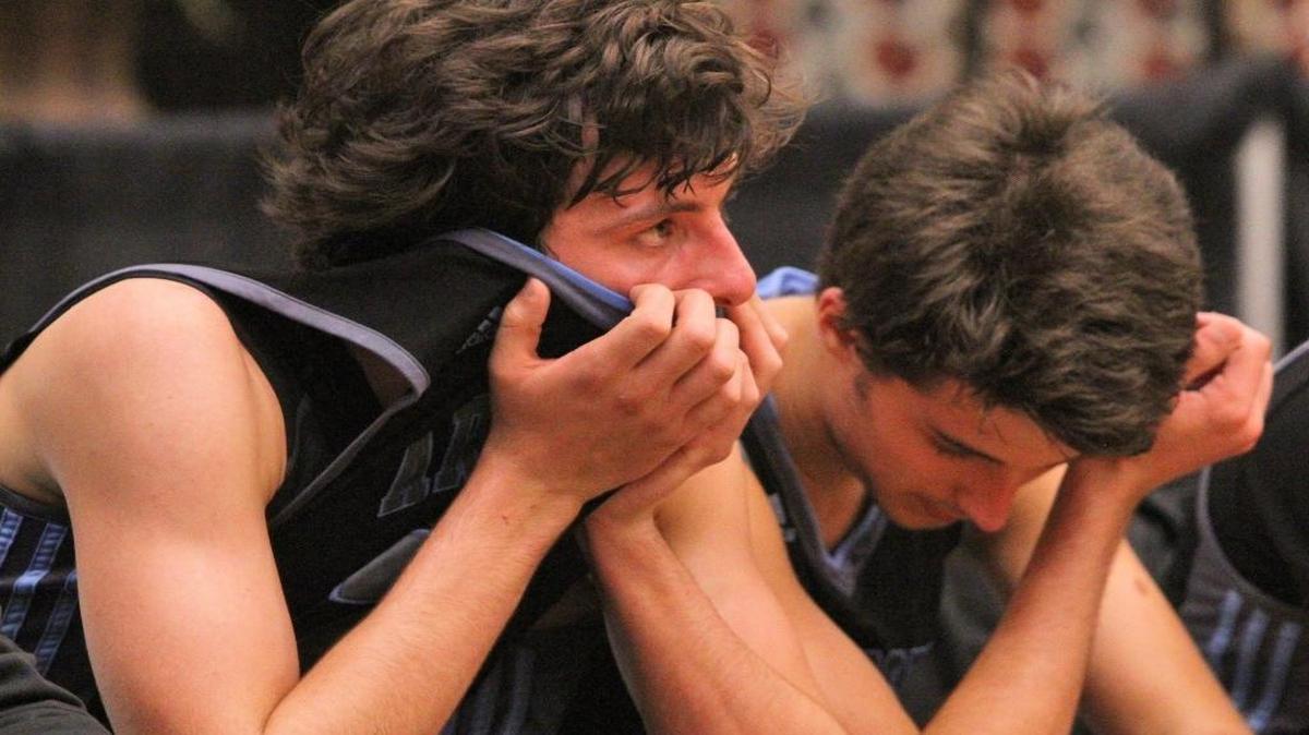 Archbishop Carroll players Christian Silva and Gus Deribeaux show their dejection during an 80-61 loss to Windermere Prep in a Class 3A semifinal Tuesday, February 23, 2016 in Lakeland, Florida.