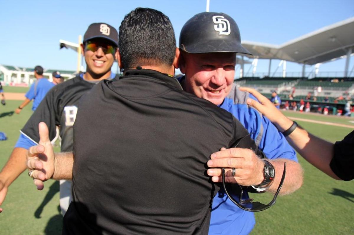 Coach Fred Burnside is congratulated after South Dade defeated Bloomingdale 3-1 to capture the Class 8A state baseball title in 2014, Burnside’s crowning achievement.