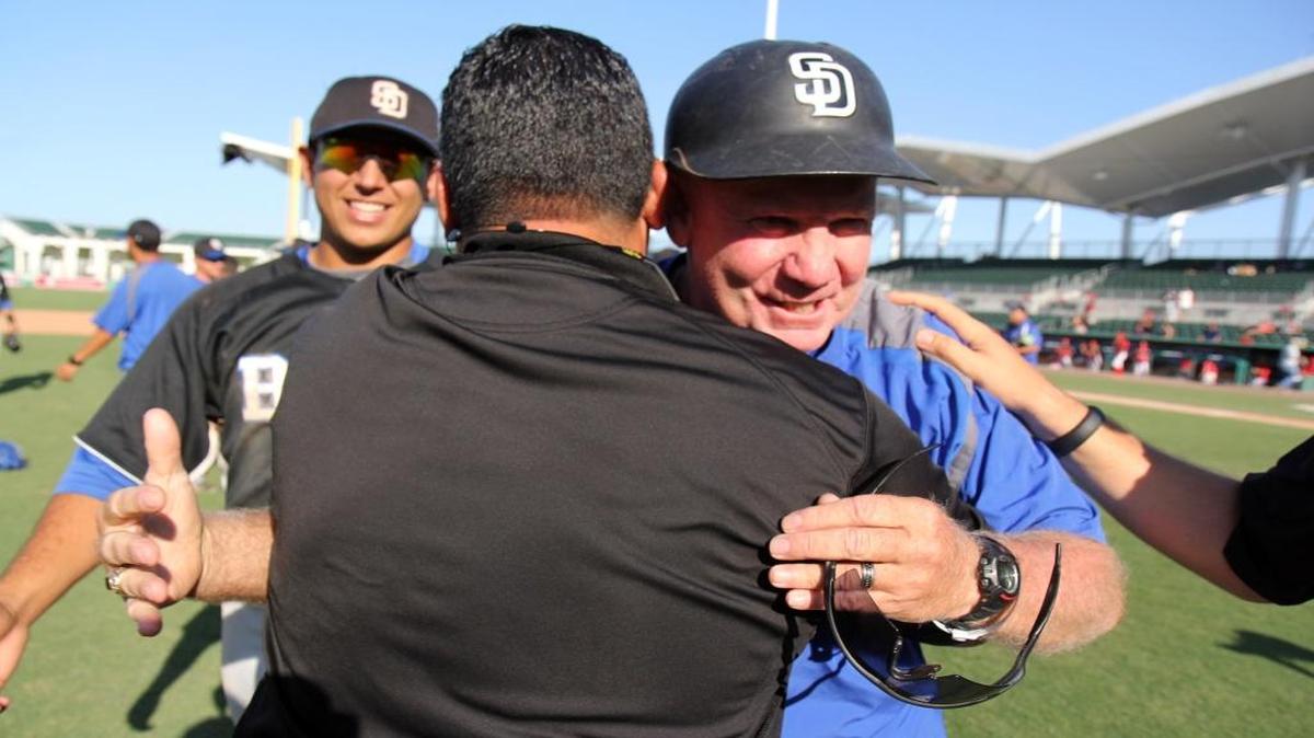 Coach Fred Burnside is congratulated after South Dade defeated Bloomingdale 3-1 to capture the Class 8A state baseball title in 2014, Burnside’s crowning achievement.