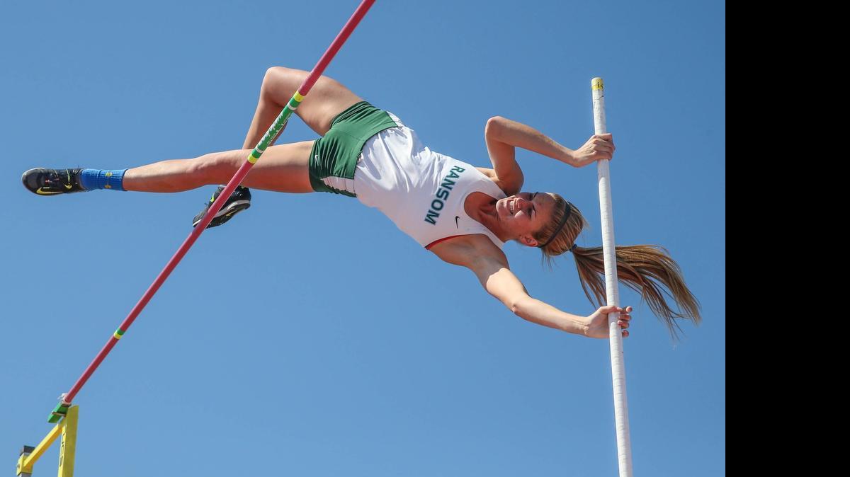 
Ransom Everglades' Nati Sheppard clears the bar at 13 feet for a new state record in the pole vault during the FHSAA Class 1A and 2A Track and Field championships at University of North Florida in Jacksonville on Friday, May 1, 2015.
