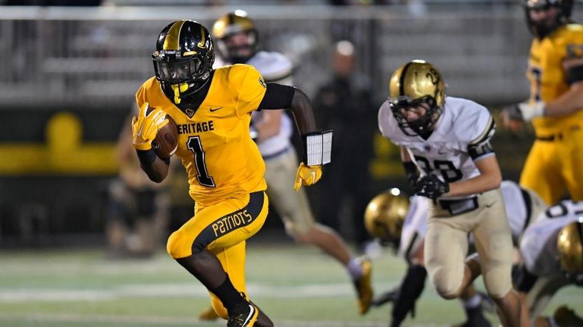 American Heritage running back Miles Jones breaks away from the Bishop Moor defense during the first half of their game, Friday, November 17, 2017.