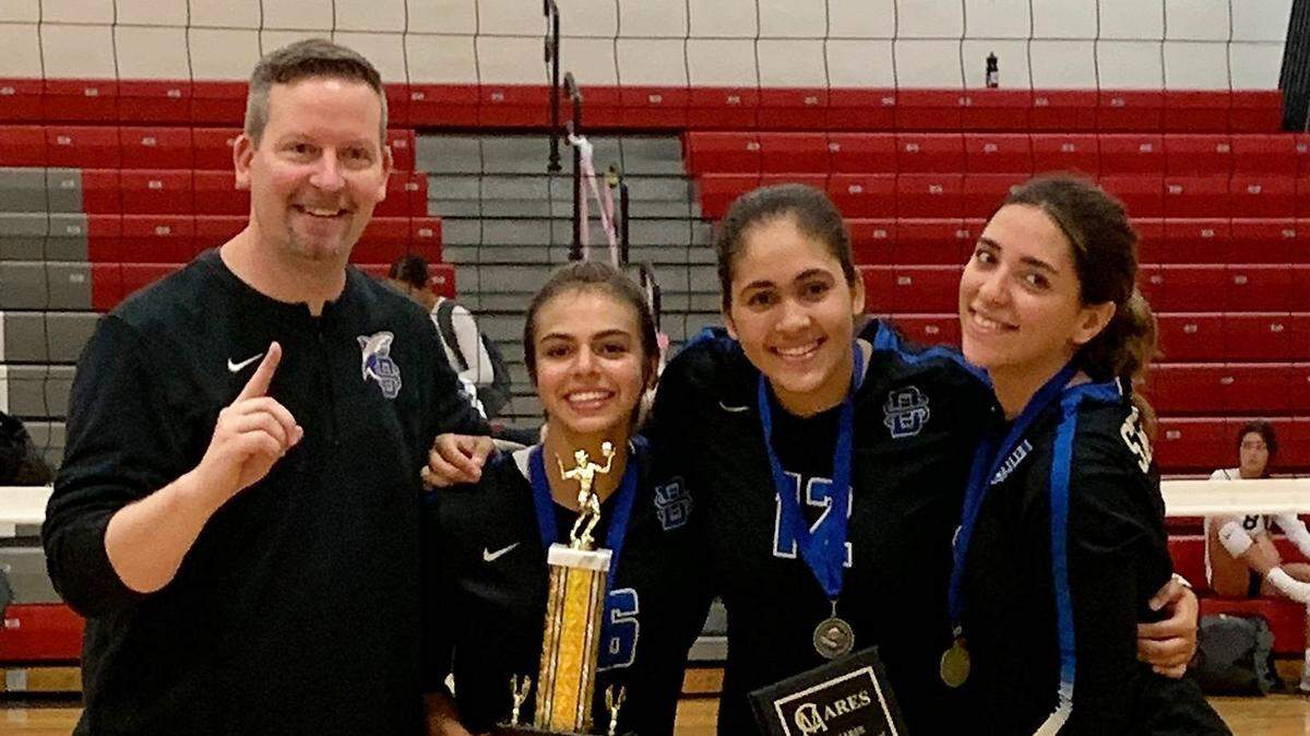 Thalia Iglesias, second from right, has been integral for the Divine Savior girls’ volleyball team this year as their setter.