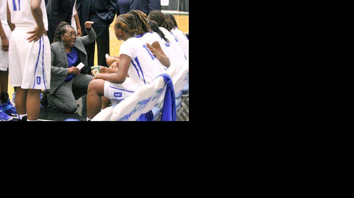 
Dillard coach Marcia Pinder gives instructions to her team during a timeout against Jacksonville Paxon during the girls’ 5A basketball championship at The Lakeland Center on Saturday, Feb. 21, 2015. 
