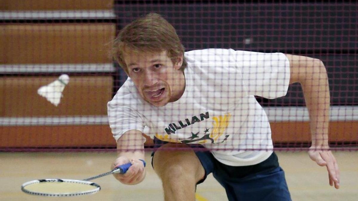 Killian’s Jason Harris takes the boys’ singles championship at the GMAC badminton finals at Braddock High on Wednesday.