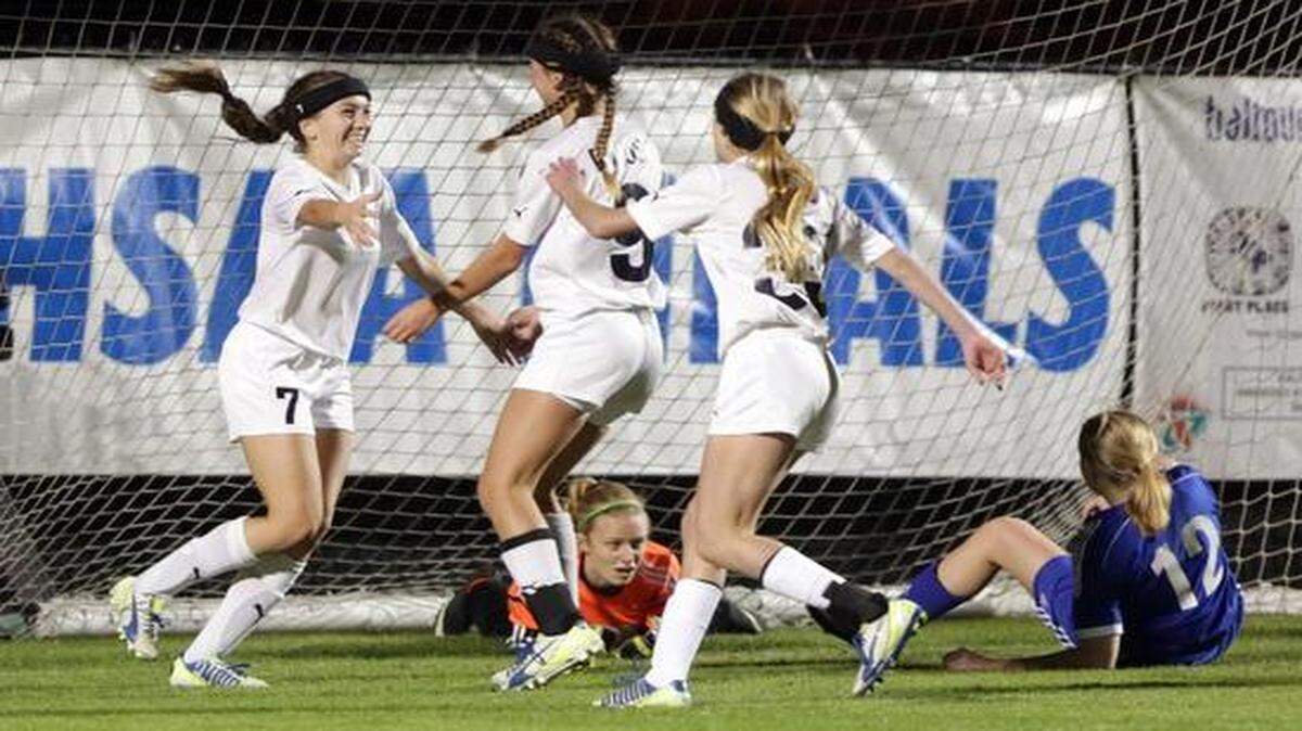 
St. Thomas Aquinas celebrates a goal during its 5-0 victory against Wellington in a Class 5A state girls’ soccer semifinal at Eastern Florida State College on Friday, Feb. 6, 2015. Aquinas won 5-0.

