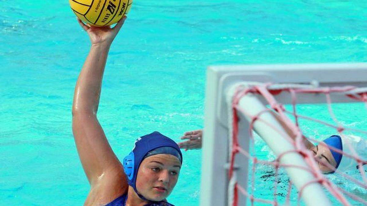 Westminster Academy’s Victoria Bevill scores against Cypress Bay in the state water polo playoffs at Westminister Academy, April 22, 2014.