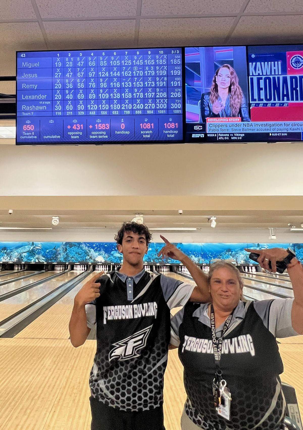 Ferguson bowling coach Marcela Y. Del Rosario with senior Rashawn Viart, after he bowled a perfect game.