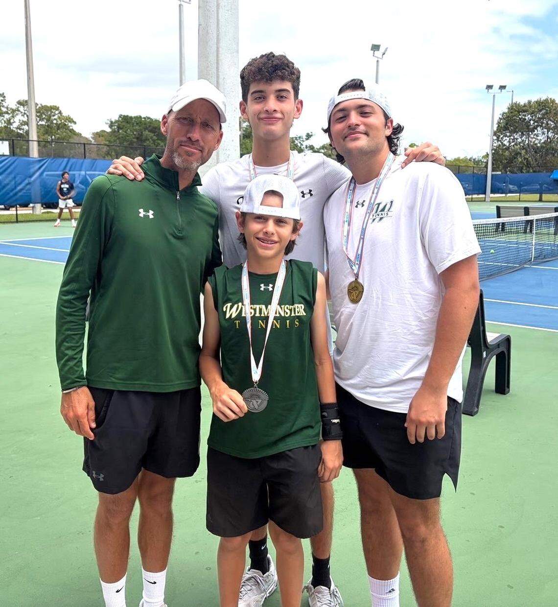 Westminster Christian tennis coach George Rangel (left), Santiago Delgado (front), Gabriel Delgado (back) and Jose Padron.