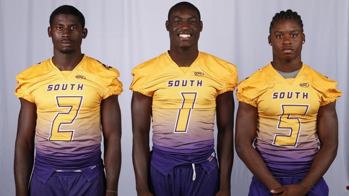 
South Plantation High’s James Aiken III, Johnny Huntley and Anthoney Julmisse. 
