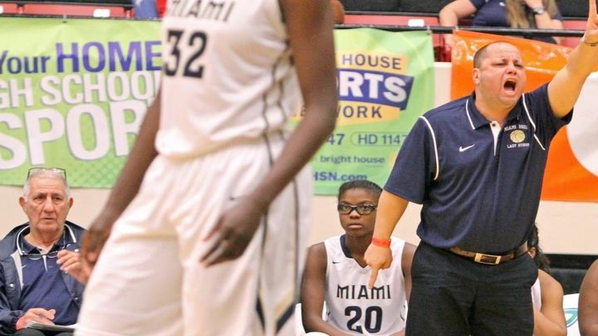 Miami Senior Sam Baumgarten yells plays from the sidelines as his team battles Colonial during the FHSAA Girls 8A Basketball championship at The Lakeland Center on Feb. 21, 2015 in Lakeland.