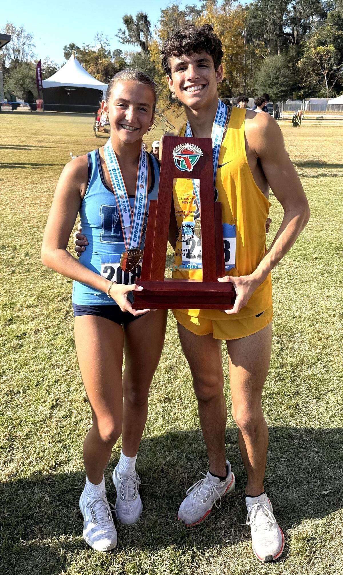 Siblings Marisa and Marcelo Mantecon won region track titles. Marisa for Lourdes and Marcelo for Belen Jesuit.