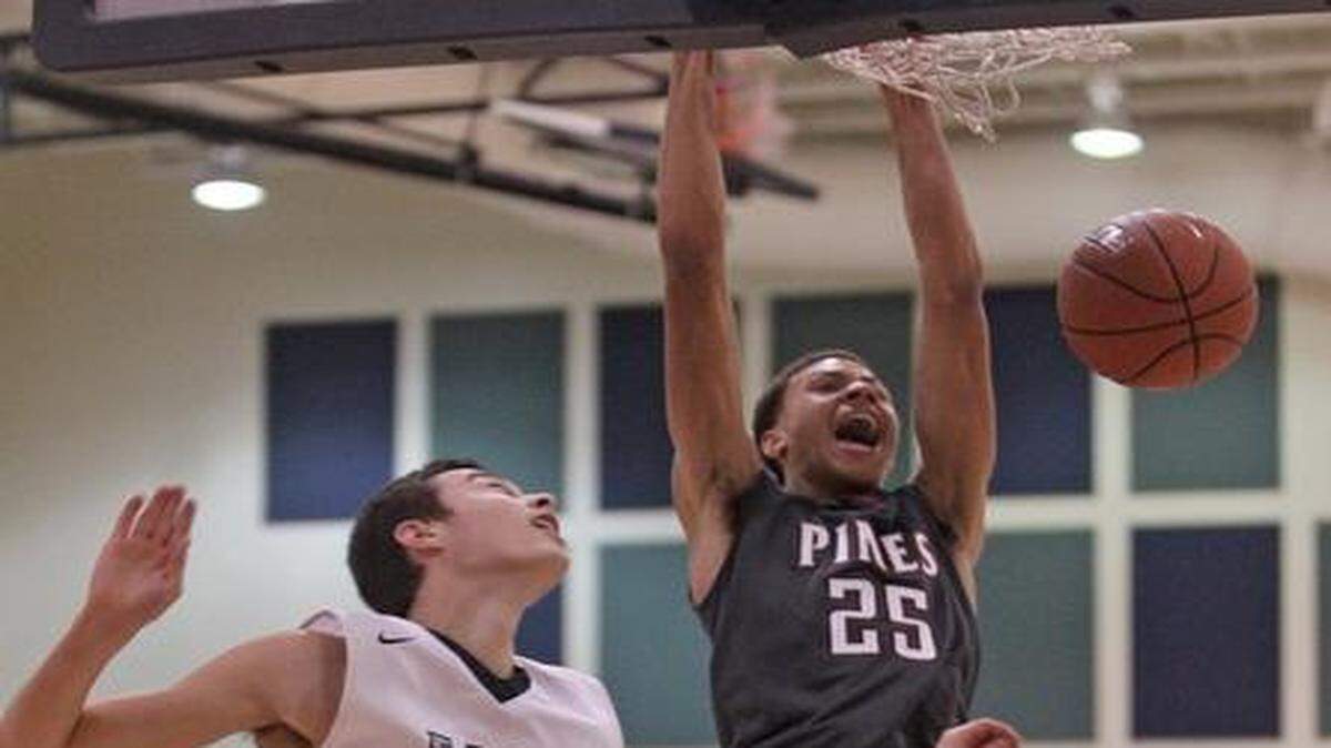 
With authority: Pines Charter's Joshua Ferguson dunks Tuesday at the boys’ Junior Orange Bowl Basketball Classic.
