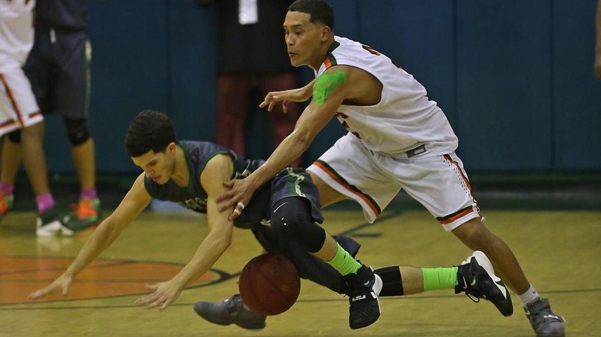 Mater Academy’s Oscar Quintana, left, and McArthur’s Luis Escobar battle for a loose ball during a regional semifinal Tuesday, Feb. 16, 2016 at McArthur High.