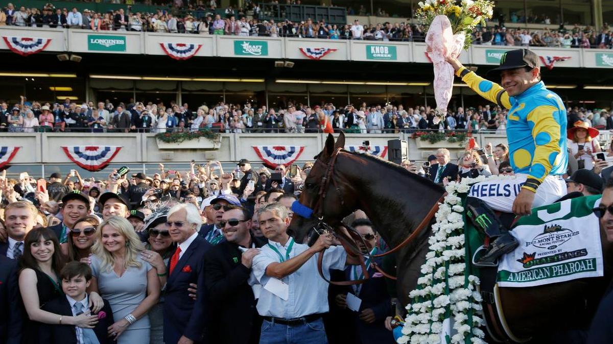 
Victor Espinoza, who twice failed to win the Triple Crown after winning the first two legs, guided American Pharoah into history as the 12th horse to complete horse racing’s ultimate achievement.
